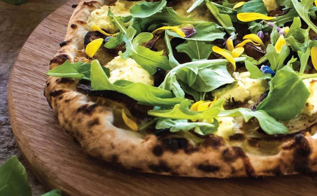 Enjoy Pizza, Vegetarian options, Restaurant, Beer Garden, Indoor & Outdoor Seating, Child-Friendly, Table service, Wheelchair accessible, $$, Families, Kids, Groups and Live music cuisine at Arbour Woodfired Pizza in Lyttelton, Christchurch