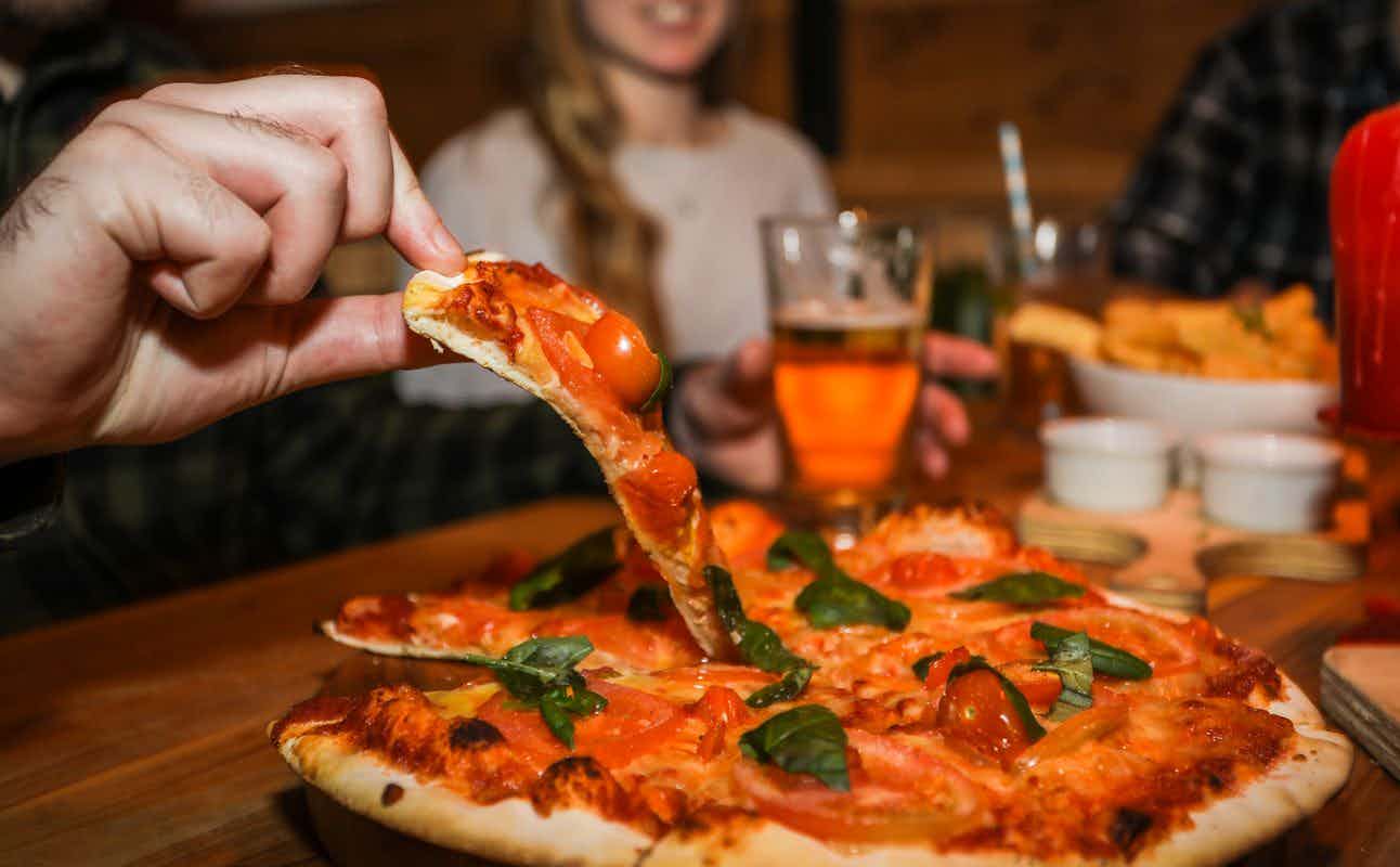 Enjoy Pub Food and Pizza cuisine at Rhino's Ski Shack in Queenstown