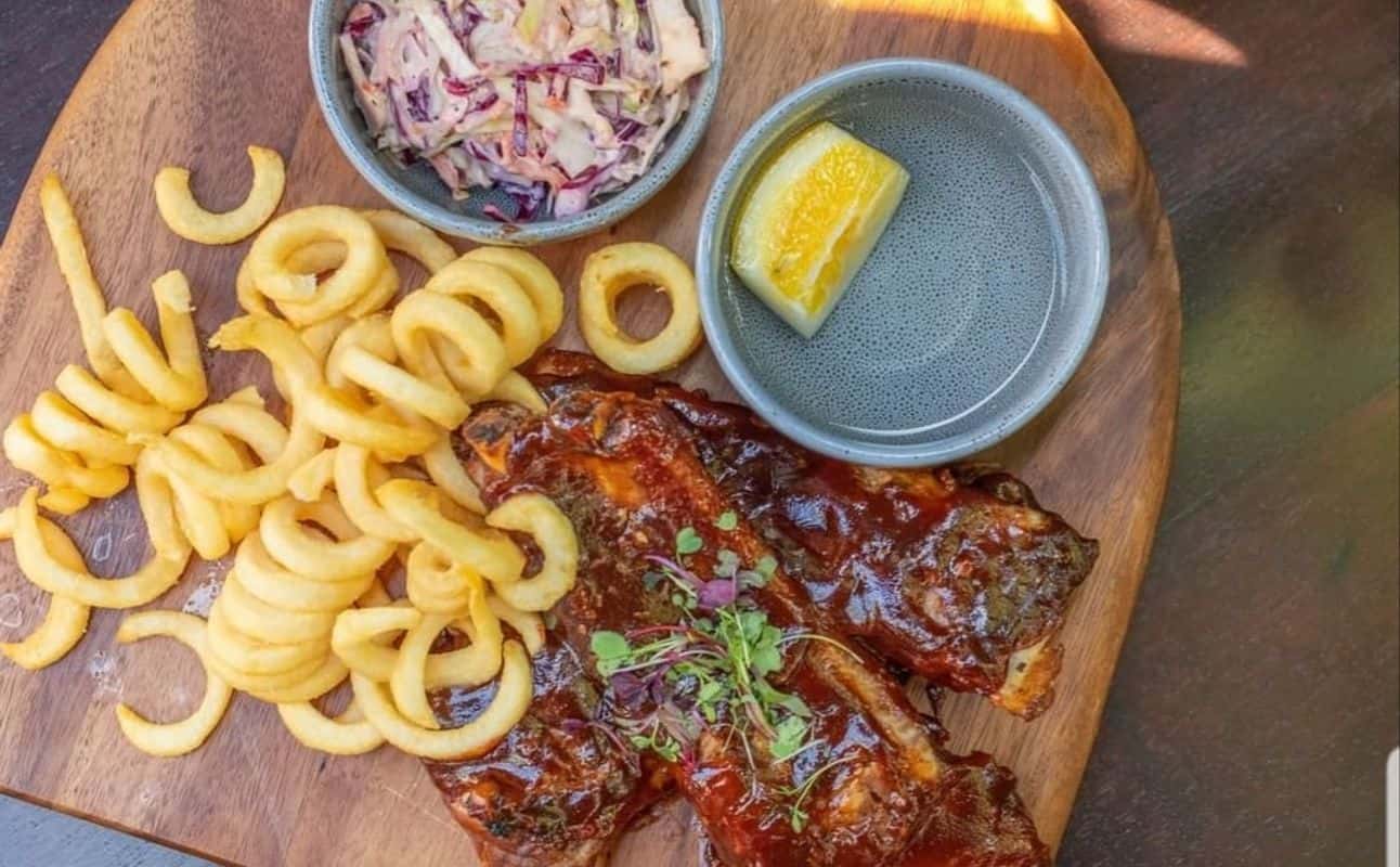 Enjoy Burgers, Pizza, Vegetarian options, Gluten Free options, Bars & pubs, Indoor & outdoor seating, Wheelchair accessible, Highchairs available, Table service, Free wifi, $$, Live music and Groups cuisine at The Rockpool in Christchurch Central, Christchurch