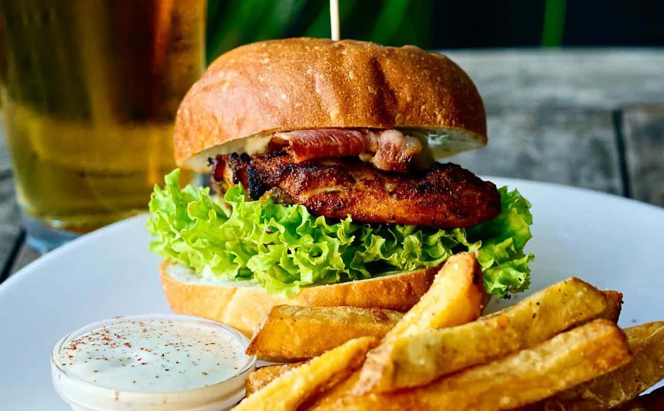 Enjoy Burgers, Small Plates, European, Dairy Free Options, Vegetarian options, Bars & Pubs, Indoor & Outdoor Seating, Table service, $$$, Live music and Groups cuisine at Reign & Pour in Commercial Bay, Auckland