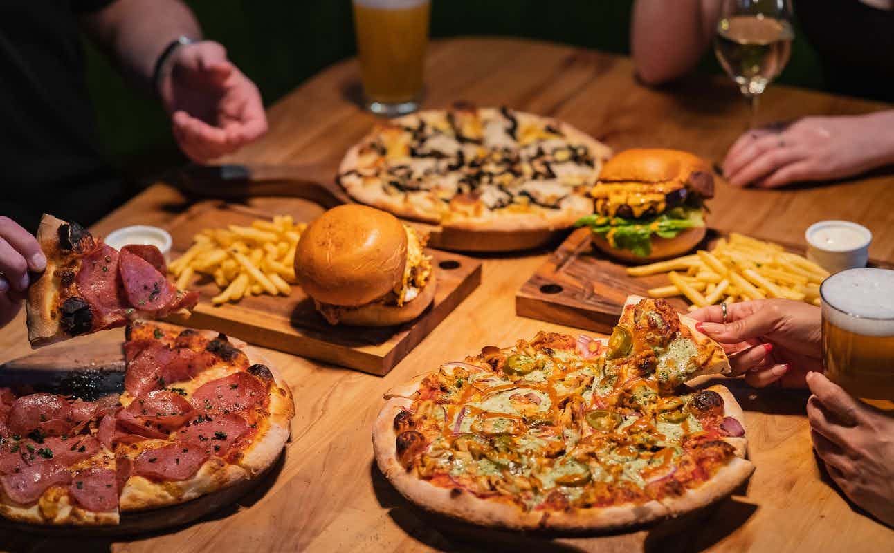Enjoy Pub Food, Pizza, Burgers, Gluten Free Options, Dairy Free Options, Vegetarian options, Bars & Pubs, $$, Bar Scene and Groups cuisine at Rhino's Ski Shack in Queenstown Town Centre, Queenstown